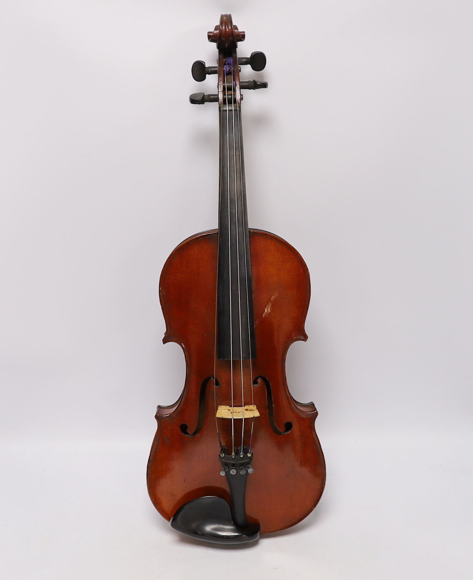 A wooden cased student violin